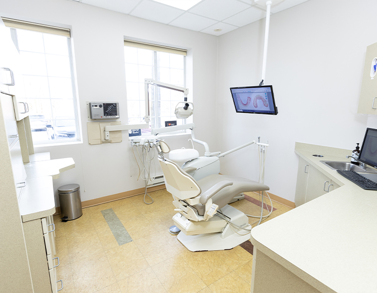 Dental treatment room in West Caldwell with all white walls