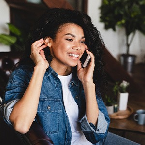 Woman smiling while talking on phone