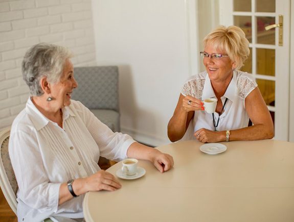 Person holding a full denture in their hand