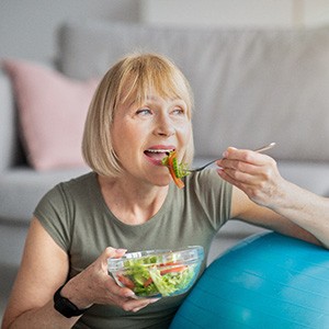Woman eating salad