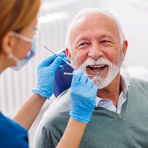 Mature man smiling during dental checkup