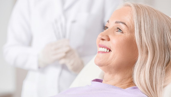 a patient smiling about getting dental implants