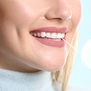woman smiling with dental implant in mouth