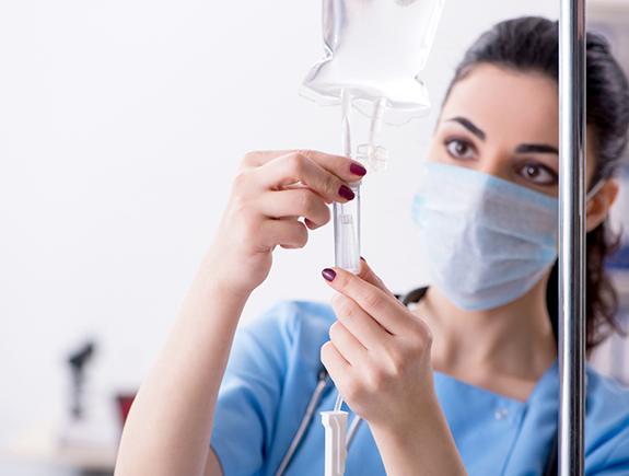 A nurse administering IV Dental sedation