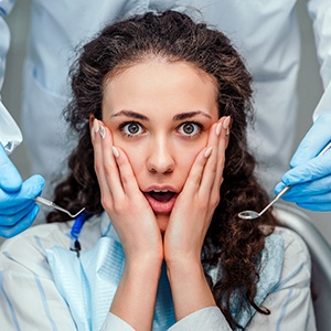 A woman who is afraid of the dentist