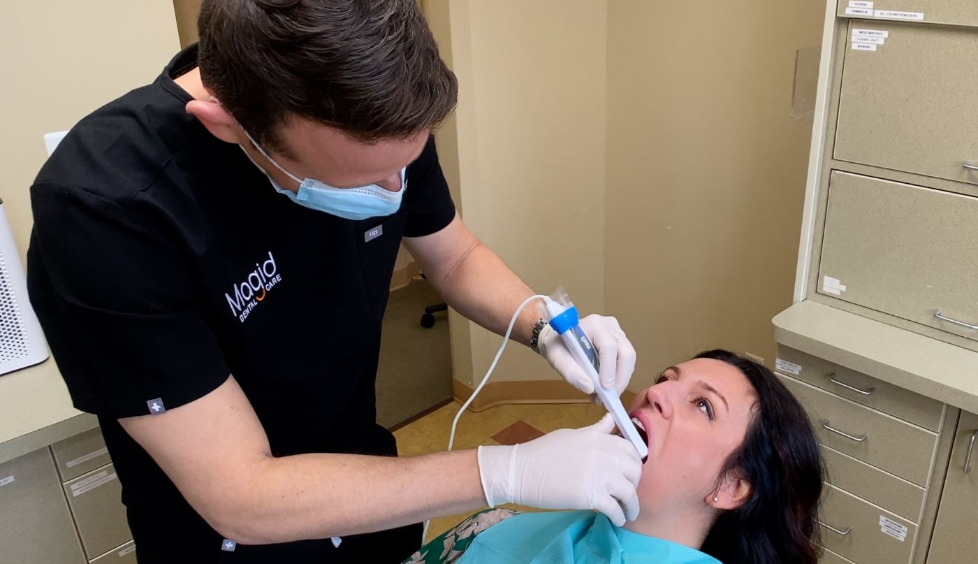 West Caldwell New Jersey dentist Doctor David Magid treating a dental patient