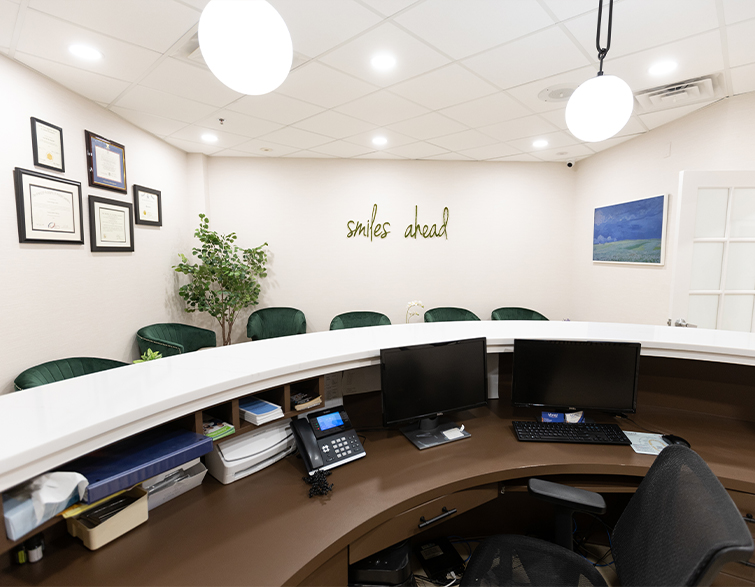 View of waiting room from behind front desk of dental office in West Caldwell