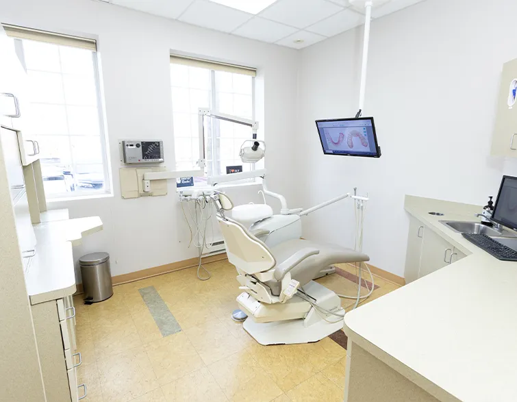 Dental treatment room in West Caldwell with all white walls