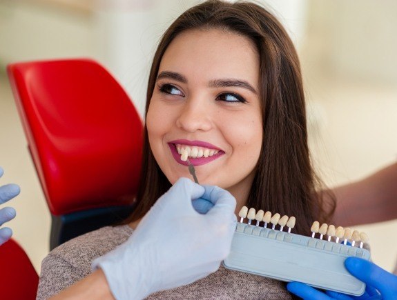 Young woman trying on dental veneers in West Caldwell