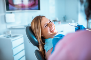 a person smiling during a dental cleaning